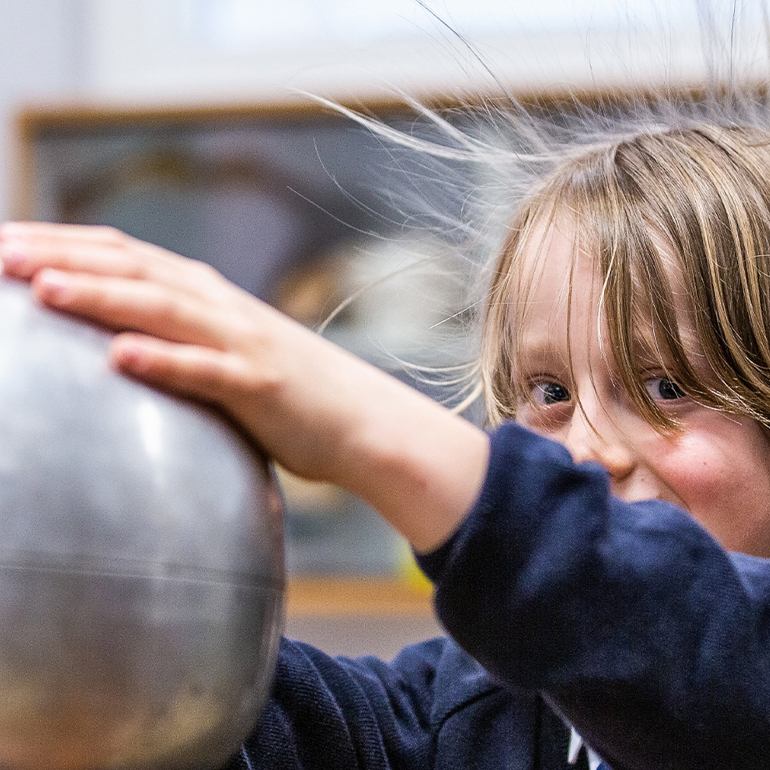Westonbirt Prep child using Van de Graaff generator in class