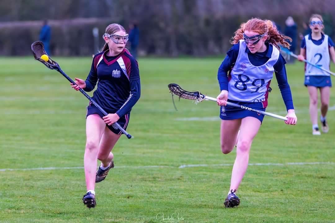 Westonbirt school pupils playing lacrosse
