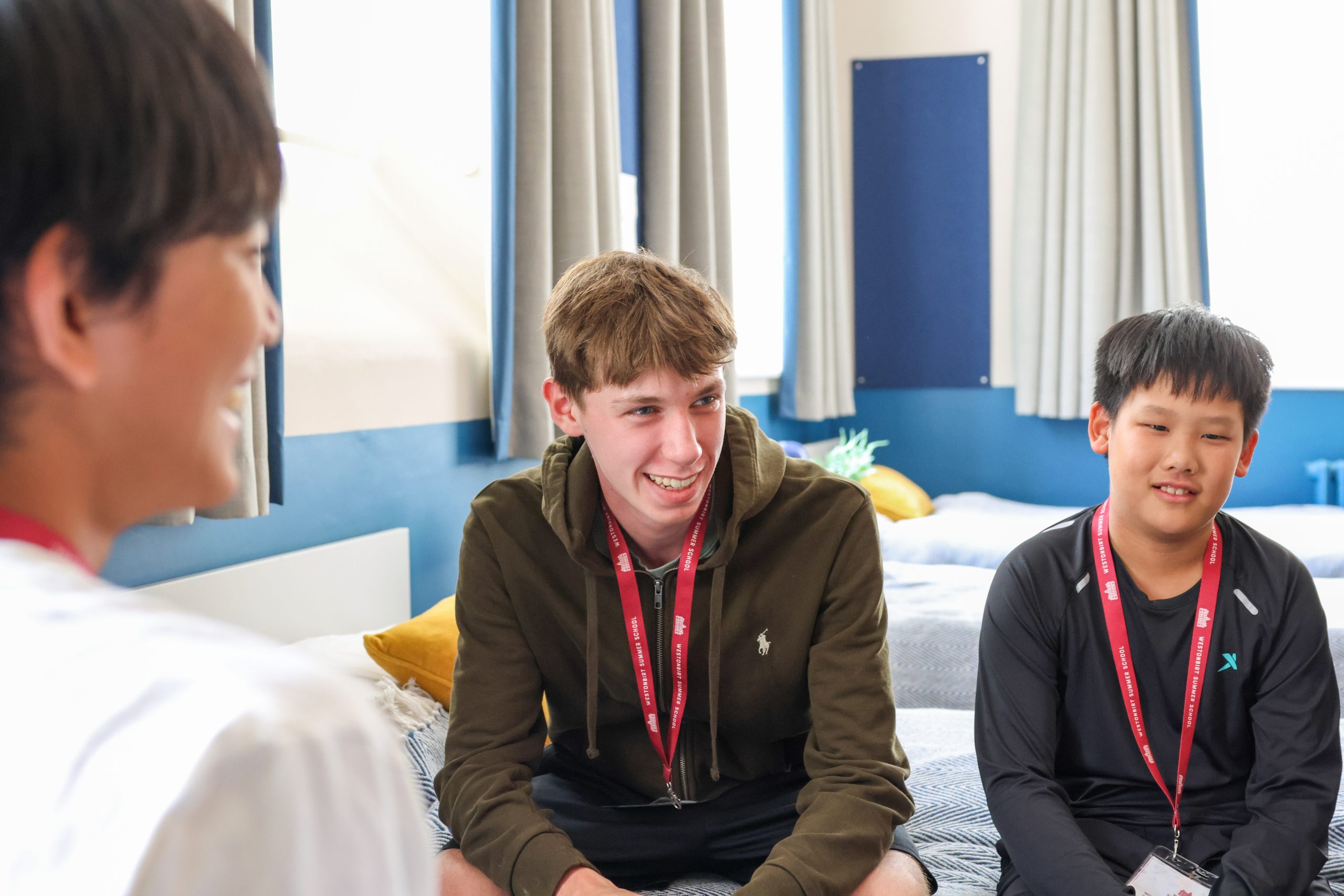 International Summer School pupils relaxing in their boarding house bedroom