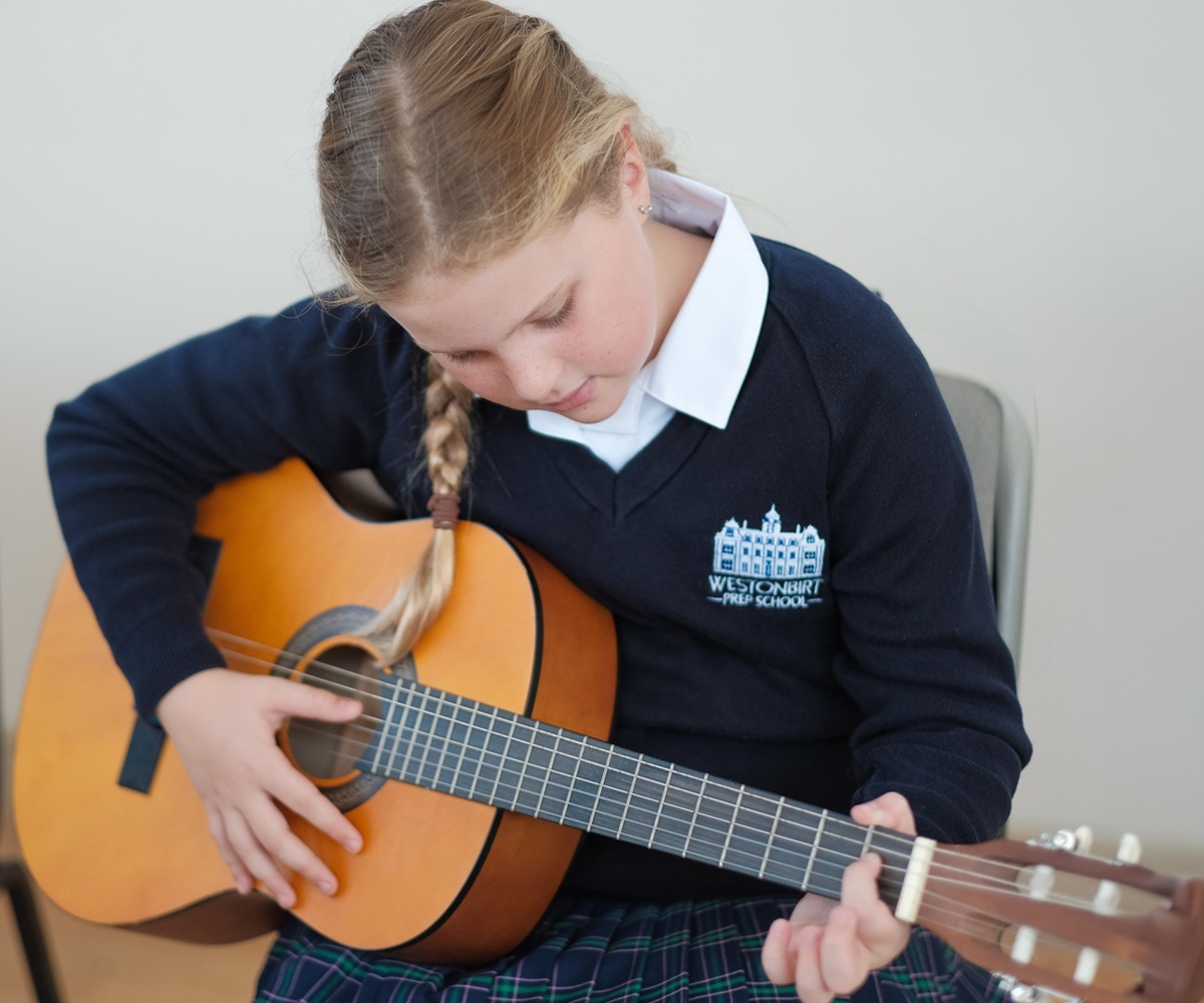 A pupil takes part in a music lesson at Westonbirt Prep School