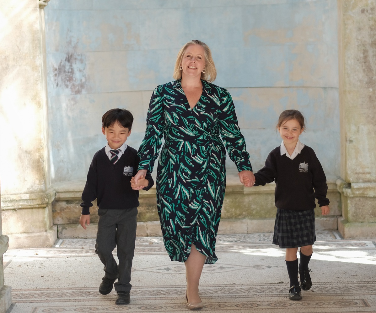 Westonbirt Prep Headmistress Rebecca Mitchell walks with two pupils