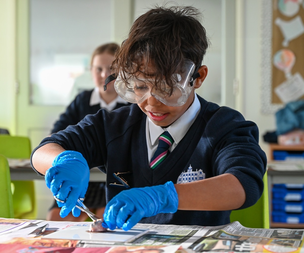 A pupil takes part in a science lesson at Westonbirt Prep School
