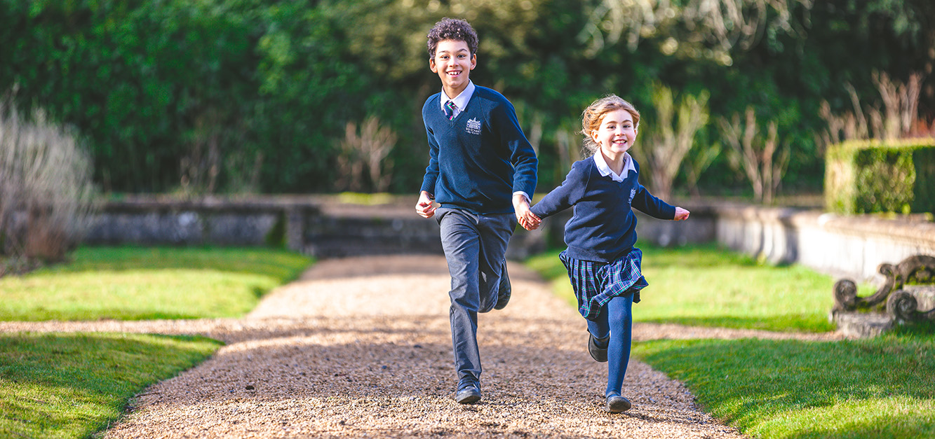 Two pupils play outside at Westonbirt Prep School