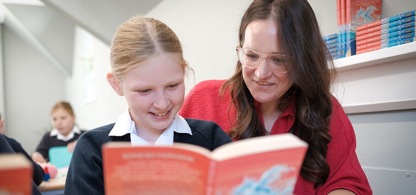 A teacher works with a pupil at Westonbirt Prep School