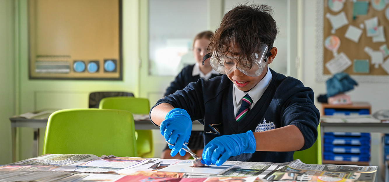 A pupil takes part in a science lesson at Westonbirt Prep School